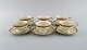KPM, Berlin. Six Royal Ivory tea cups with saucers in cream-colored porcelain 
with gold decoration. 1920s.
