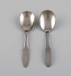 Gundorph Albertus for Georg Jensen. Two Mitra jam spoons in stainless steel. 
1970s.
