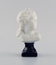 Limoges France. Biscuit child bust. Stand with dark blue glaze. Classic style. 
Early 20th century.

