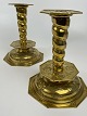 Pair of beautiful octagonal candlesticks, baroque form, brass with flowers and 
leaves in tendrils