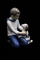 Bing & Grondahl porcelain figurine of a boy with a dog. 
B&G 2334...