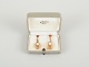 Wallins, Sweden.
A pair of earrings in 14 carat gold adorned with cultured pearls.