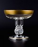 Rimpler Kristall, Zwiesel, Germany, mouth blown crystal champagne glass with 
gold rim decorated with grapes and vine leaves.