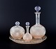 Baccarat, France, Art Deco crystal glass service with a wine carafe, covered 
bowl, and flacon on a round serving tray.