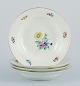 Bing & Grøndahl, Saxon Flower, a set of four deep plates hand-decorated with 
polychrome flowers and gold rim.