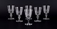 A set of six mouth-blown French white wine glasses in crystal glass. Faceted 
cut.