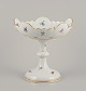 Meissen, Germany. Large porcelain centerpiece.
Hand-painted with polychrome floral motifs.