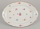 Meissen, Germany. Large oval serving platter in porcelain.
Hand-painted with polychrome floral motifs.