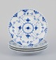 Royal Copenhagen Blue Fluted Half Lace, a set of four small lunch plates.