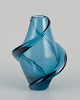 Scandinavian glass artist. Handmade art glass vase in turquoise glass.