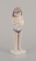 Royal Copenhagen porcelain figurine of a girl with a rabbit.