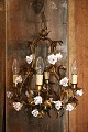 Old French chandelier with base in gilt metal decorated with a lot of fine old 
porcelain flowers...