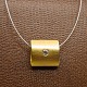 Antik 
Damgaard-
Lauritsen 
presents: 
Necklace 
with a 14k gold 
pendant set 
with diamond