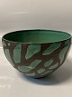 Ceramic glazed bowl, in green and brown colours.