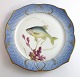 Lundin Antique 
präsentiert: 
Royal 
Copenhagen. 
Angelgestell 
Nr. 19. Modell 
3002. 
Durchmesser 
22,5 cm. 
Leuciscus ...