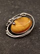 Sterling silver brooch with amber