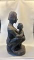 Stentoft Antik 
præsenterer: 
Uglaseret 
stentøj figur .
Højde 24 cm 
Bedder 16 cm
