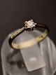 18 carat white 
gold ring with 
diamond