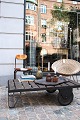 Old French industrial coffee table, an old industrial pallet cart in iron on 
wheels and wooden slats on top...