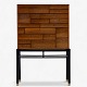 Jørgen Berg / William Christensen.
Rare cabinet in rosewood with drawers and black lacquered frame with brass 
shoes.
1 pc. in stock
