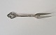 Serving fork in silver and steel decorated with bunch of grapes