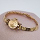 Rolex; Orchid dameur af 18 kt. guld med diamanter, med lænke i 14 kt. guld