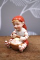 K&Co. præsenterer: Royal Copenhagen Pixie nisse i porcelæn , nr.760.Nisse dreng med grød.