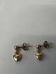 Hjerte øreringe i 14 karat guld.Længde 1,3 cm.