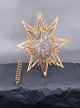 Georg Jensen Denmark Christmas decorations. 24 different candle holders in gilded brass, placed in 2 shelves in a wooden box