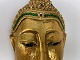 Buddha ansigt af træ, guldbemalet med glasflusser, slutningen af det 20. århundrede