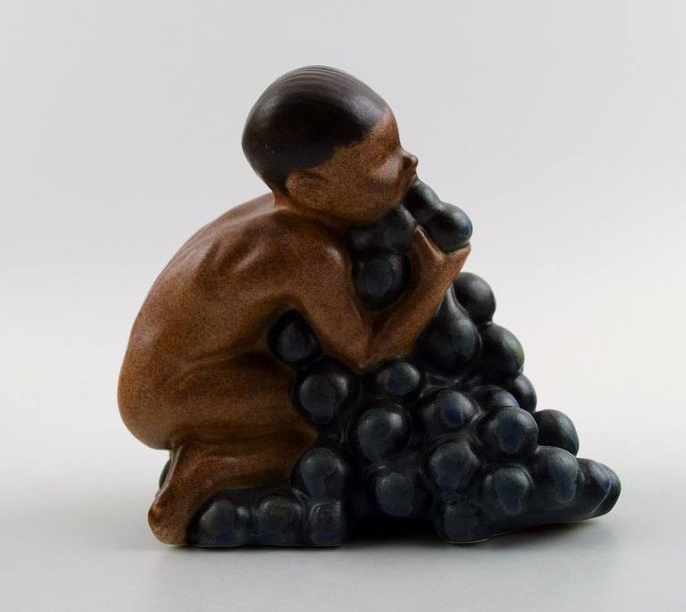 Bing & Grondahl, stoneware figurine of boy with bunch of grapes by Kai Nielsen.
Model number 4021. From the series 