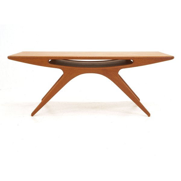 Table, Danish Design by Johannes Andersen: "The Smile", teak. Circa 1957. H: 
51cm. L: 134cm. W: 51cm