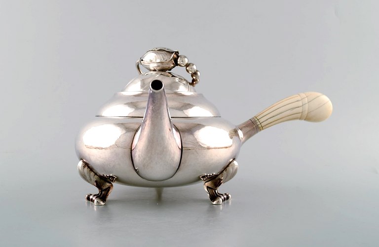 Georg Jensen "Blossom" teapot of hammered sterling silver. 
