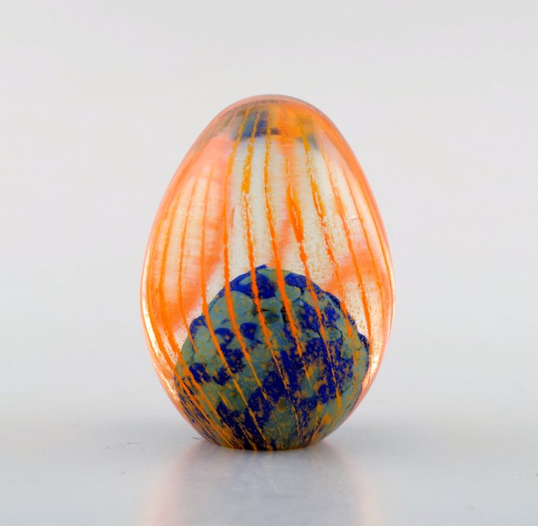 Monica Backström for Kosta Boda, Sweden. Eggs in clear mouth blown art glass 
decorated with orange stripes.