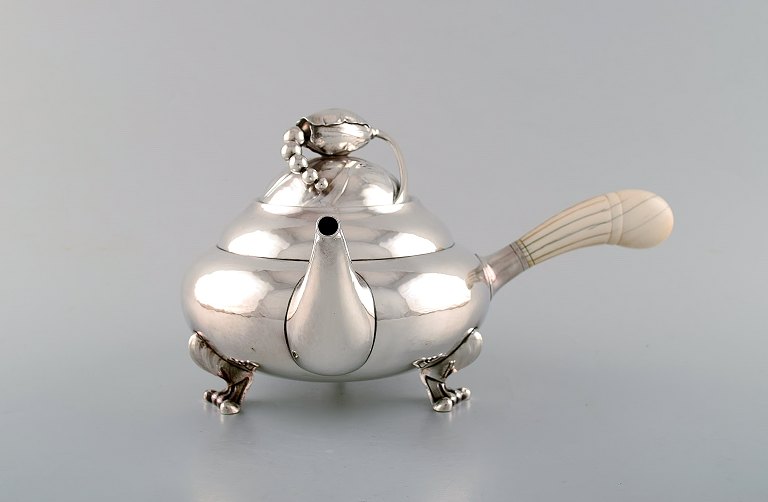 Georg Jensen "Blossom" teapot of hammered sterling silver. 
