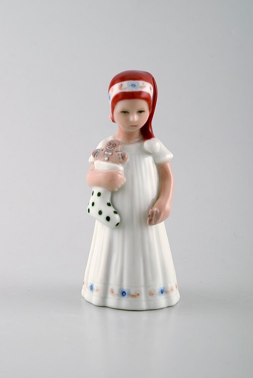 Rare Royal Copenhagen porcelain figurine. Girl with christmas stocking and 
gingerbread man. Model number 093.
