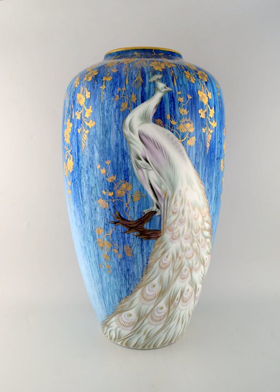 Heinrich, SELB Bavaria Germany. Large hand painted porcelain vase with peacock 
and gold decorated leaves. 1960