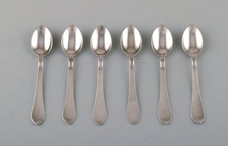 Georg Jensen "Continental" cutlery. Six coffee spoons in hammered sterling 
silver. 
