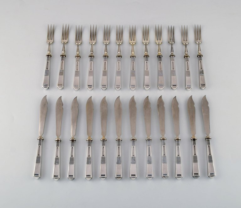 Bremer silberwarenfabrik, Germany. Art deco fish cutlery service in silver 
complete for 12 people. Ca. 1910.
