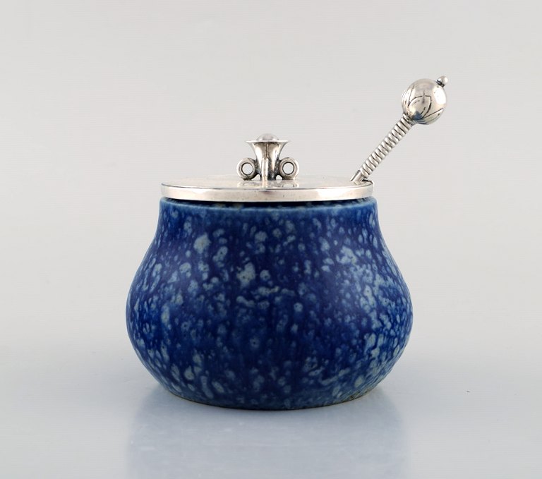 Hans Hansen (1884-1940) and Bode Willumsen (1895-1987).
Unique marmalade jar of bluish glazed stoneware, with lid
and marmalade spoon by Hans Hansen in sterling silver.
Signed "BW" and Hans Hansen. 1930