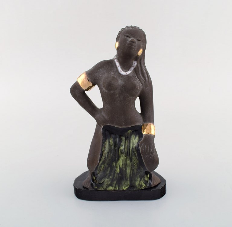 Bengt Wall, Sweden. Balinese girl in raw and glazed ceramics with gold 
decoration. 1950