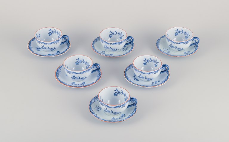 Nils Emil Lundström for Rörstrand, Sweden, set of six "Ostindia" coffee cups and 
saucers in faience with flower motifs.