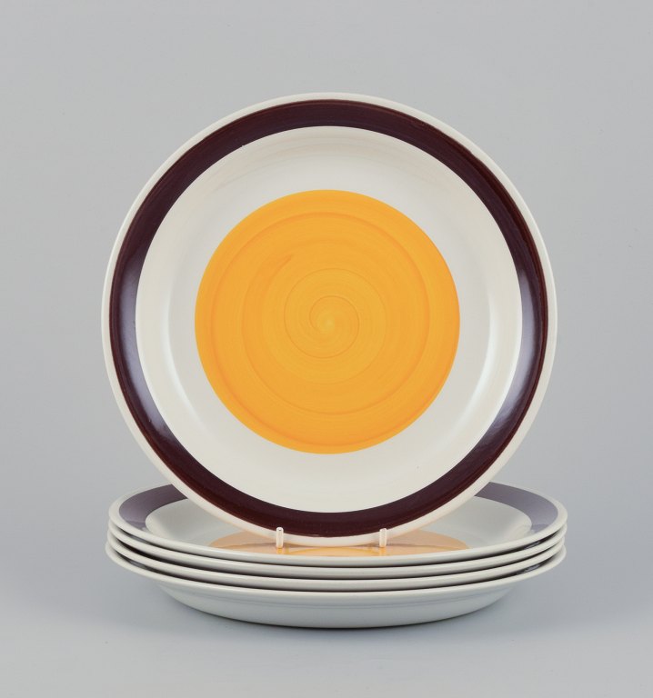 Carl Harry Stålhane (1920-1990) for Rörstrand, Sweden. A set of five deep 
"Solöga" (Sun Eye) dinner plates in earthenware.