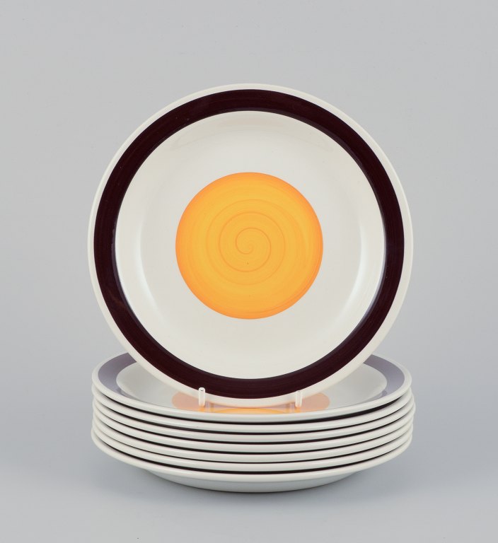 Carl Harry Stålhane (1920-1990) for Rörstrand, Sweden. A set of eight "Solöga" 
(Sun Eye) plates in earthenware.