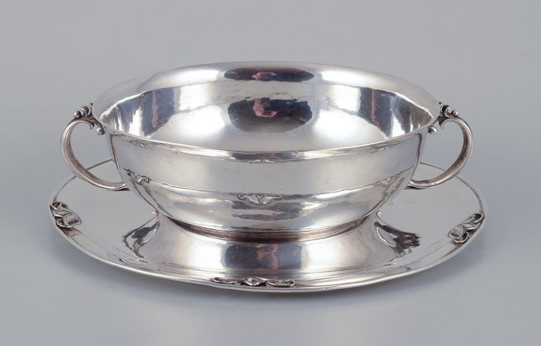 Harald Nielsen for Georg Jensen. Bowl with handles on matching sterling silver 
saucer.