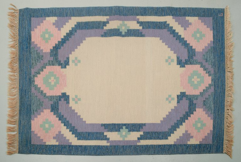 Swedish handwoven carpet in pure wool. Rölakan technique. Geometric pattern in blue, white, and pink colors.
