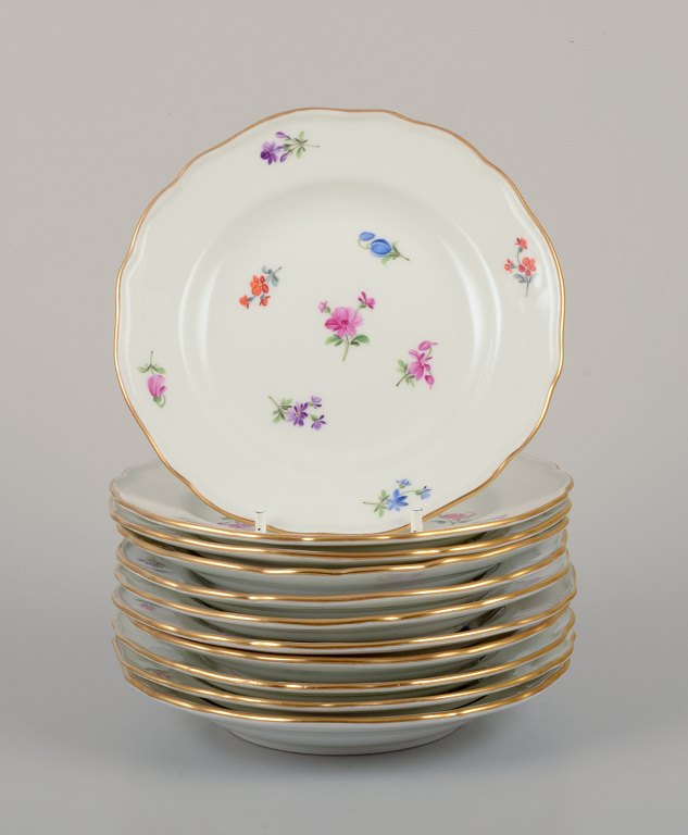 Meissen, Germany.
A set of eleven small plates in porcelain.