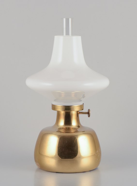 Henning Koppel for Louis Poulsen. 
Petronella oil lamp in brass with opal glass shade.