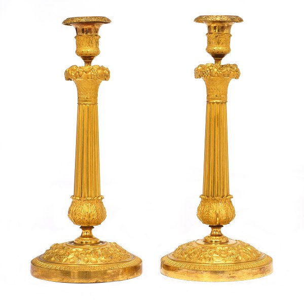 Pair of early 19th century French firegilt bronze candlesticks. France circa 
1810-20. H: 31cm
