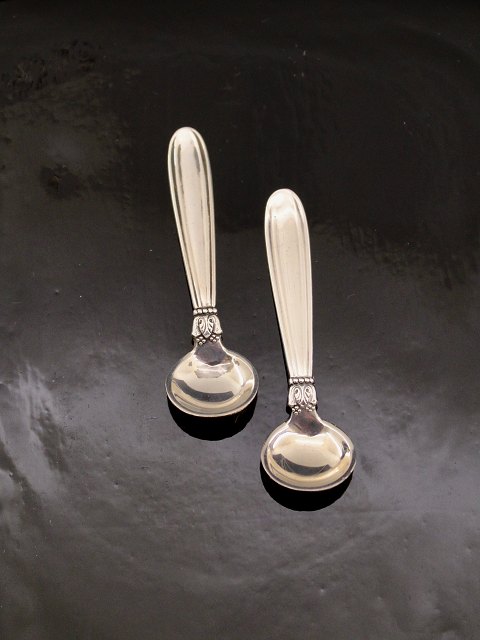 A pair of karina silver salt spoons